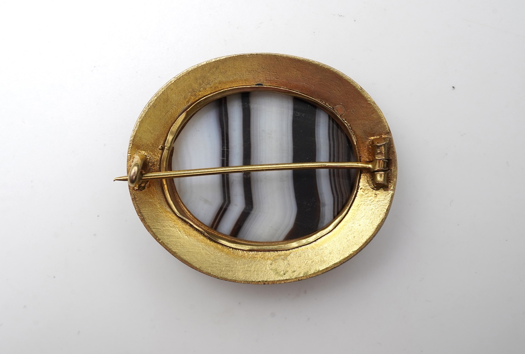 An enamel and onyx demi-parure, late 19th century